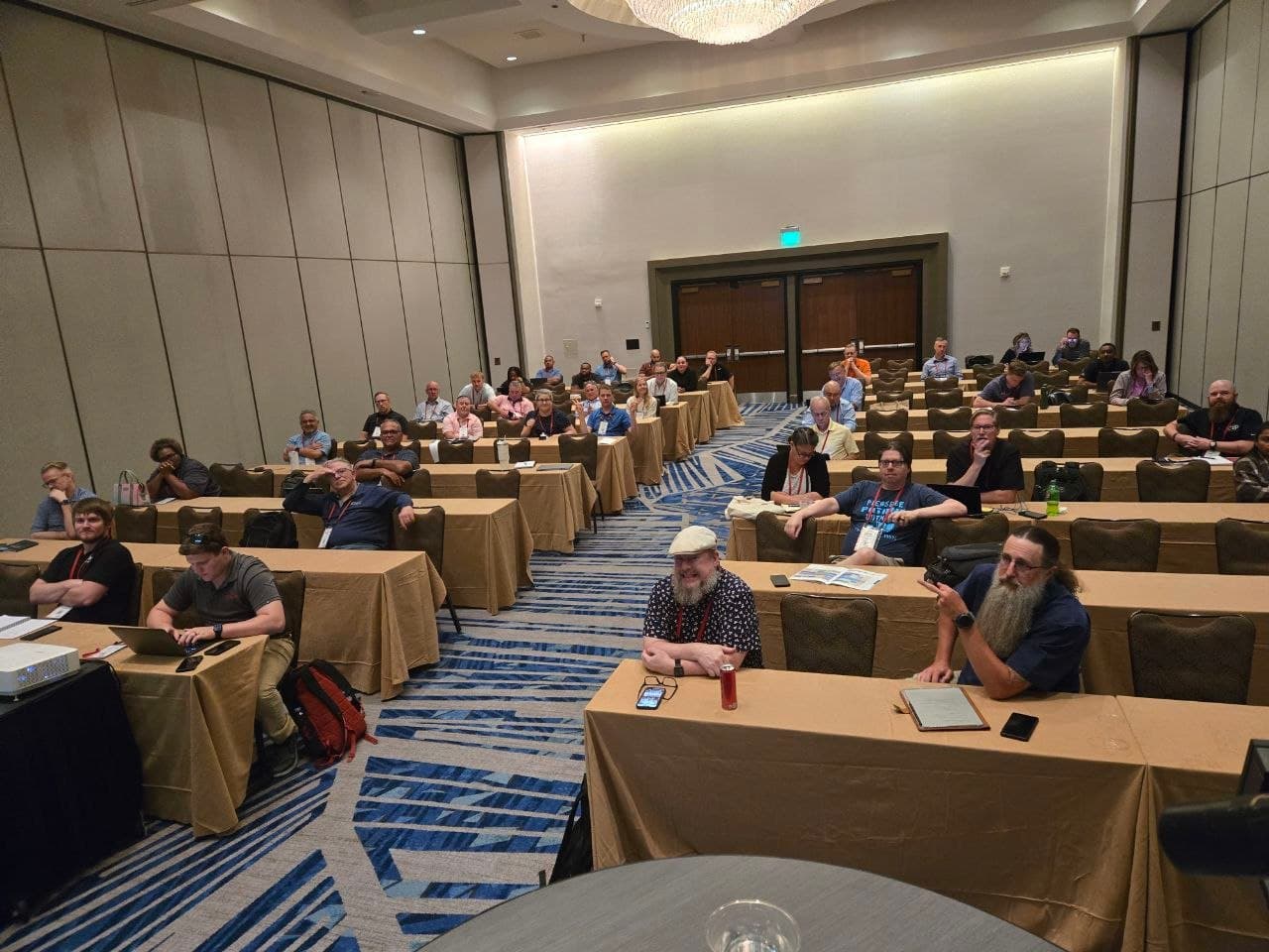 Attendees seated at tables during a Prophet 21 training session